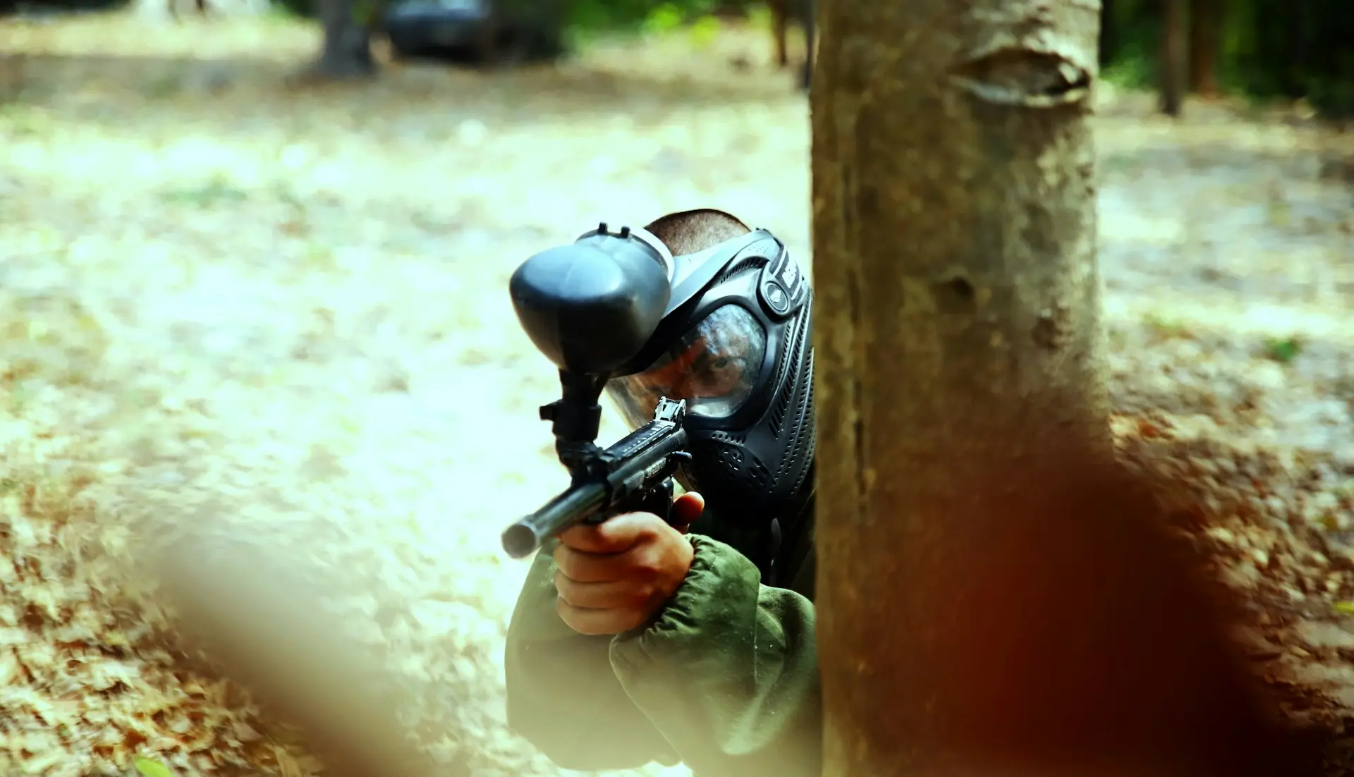 person holding paintball gun